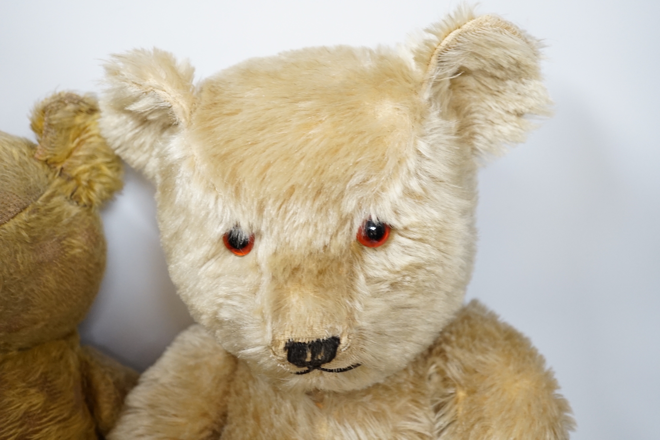 A Chiltern bear c.1950's, 55cm, tear to one velvet pad otherwise in good condition, and a 1930's bear, 50cm, repaired paw pads and nose